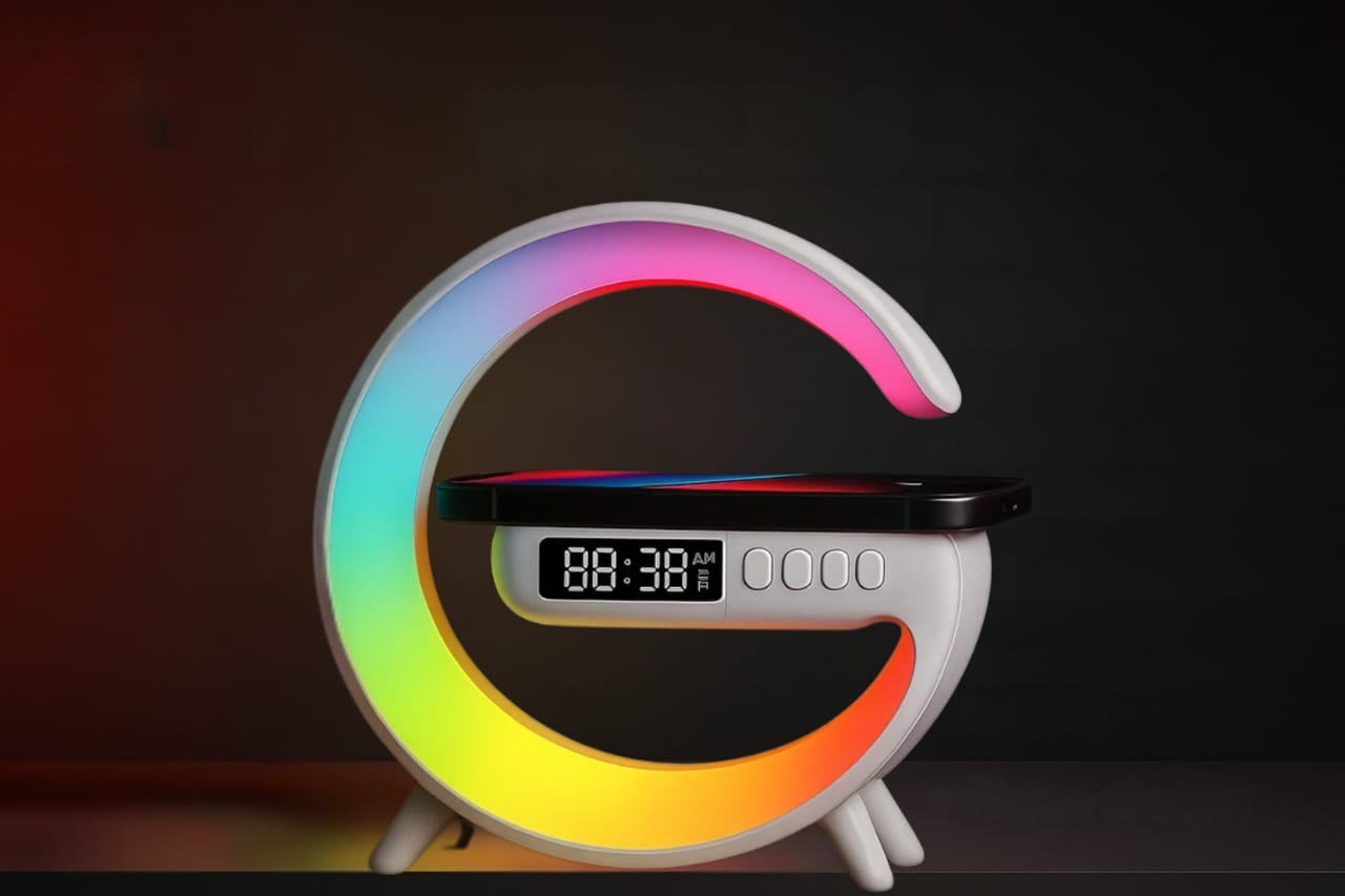 Colorful circular clock with digital display on a dark background